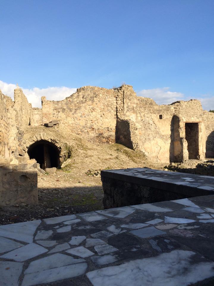 The remains of a bar and oven which were the equivalent of a restaurant. These types of "buildings" were scattered all along Pompeii.